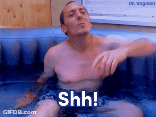Shirtless Man In Bathtub Saying Shh GIF