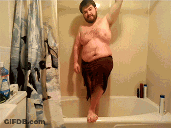 Shirtless Man In Bathtub With Penguin Shower Curtain GIF
