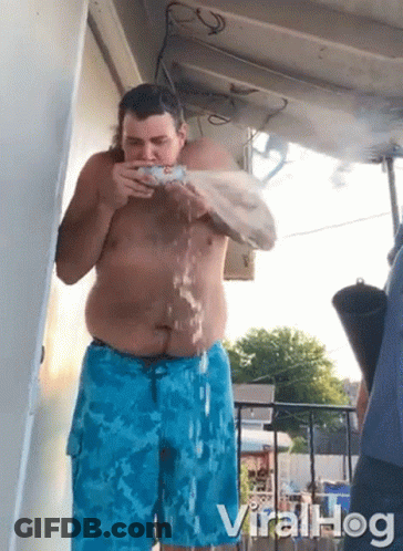 Shirtless Man In Blue Shorts Drinking Water GIF