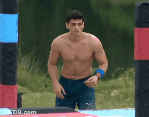 Shirtless Man In Blue Shorts Walking Maze GIF
