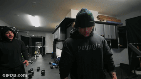 Shirtless Man In Blue Shorts With Red K GIF