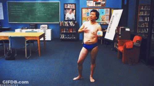 Shirtless Man In Blue Swim Trunks Dancing In Classroom Benzosocks GIF