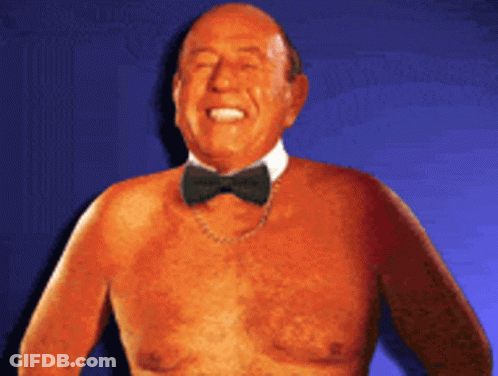 Shirtless Man In Bow Tie And Chain GIF