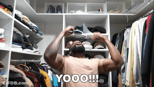 Shirtless Man In Closet With Yooo On Back GIF