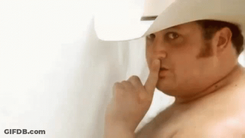 Shirtless Man In Cowboy Hat Shushing GIF