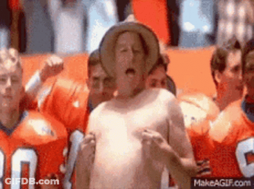 Shirtless Man In Cowboy Hat With Group In Orange Jerseys GIF