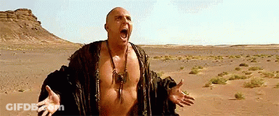 Shirtless Man In Desert With Mouth Open GIF