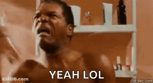 Shirtless Man In Front Of Bathroom Shelf GIF