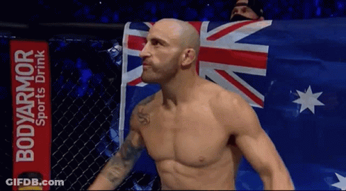 Shirtless Man In Front Of BodyArmor Sign GIF