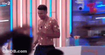 Shirtless Man In Front Of Crowd GIF