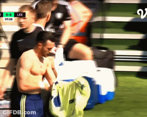 Shirtless Man In Front Of Lee Scoreboard GIF