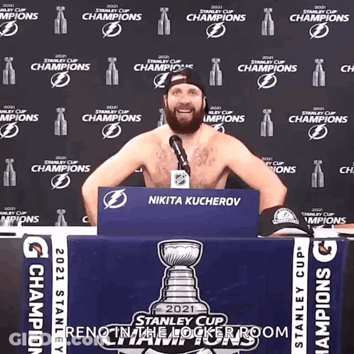 Shirtless Man In Front Of Stanley Cup Sign GIF