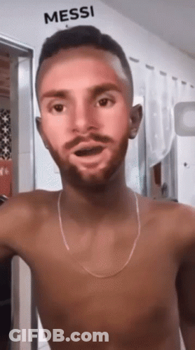 Shirtless Man In Front Of Wall Saying Messi GIF