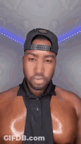 Shirtless Man In Hat And Tie GIF