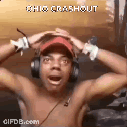 Shirtless Man In Headphones And Red Hat Holding Head GIF