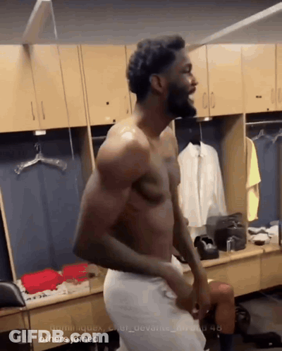 Shirtless Man In Locker Room With Others GIF