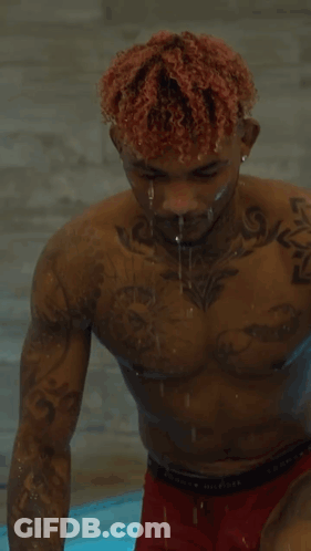 Shirtless Man In Red Boxer Shorts Standing In Pool GIF