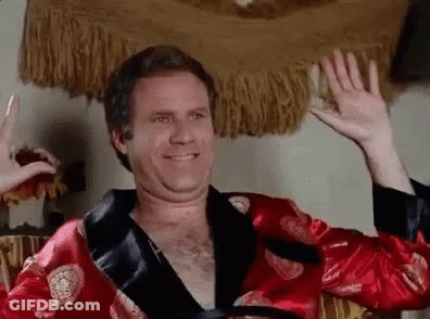 Shirtless Man In Red Robe Waving GIF