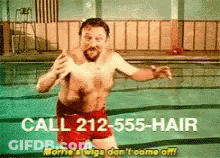 Shirtless Man In Red Shorts Jumping Into Pool GIF