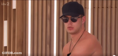 Shirtless Man In Sunglasses And Baseball Cap GIF