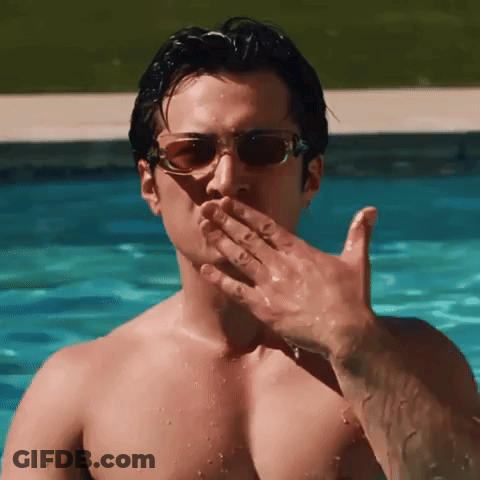 Shirtless Man In Sunglasses Blowing A Kiss GIF