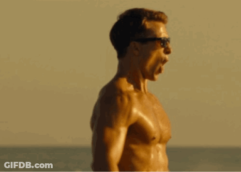 Shirtless Man In Sunglasses Screaming On Beach GIF