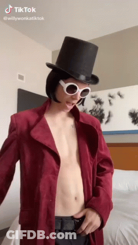 Shirtless Man In Top Hat And Sunglasses GIF