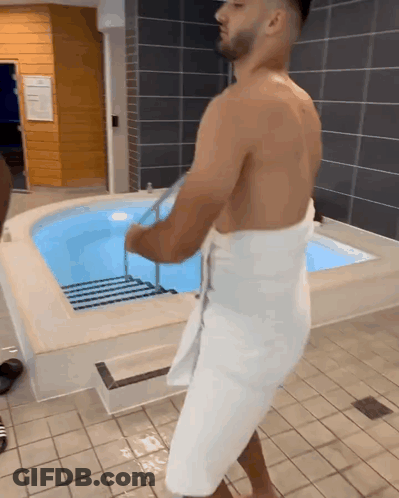 Shirtless Man In White Towel By Pool GIF