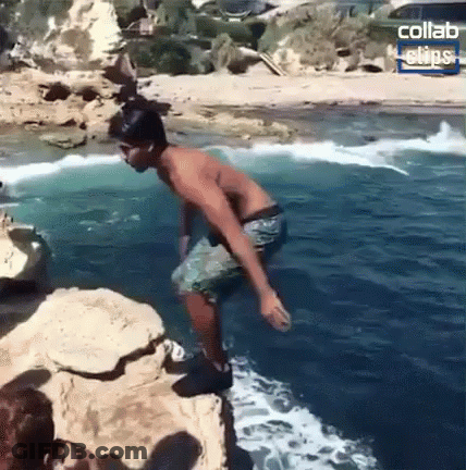 Shirtless Man Jumping Into Ocean GIF
