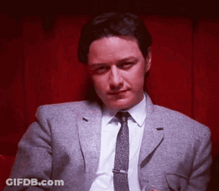 Shirtless Man Laying On Bed With Blue Blanket GIF