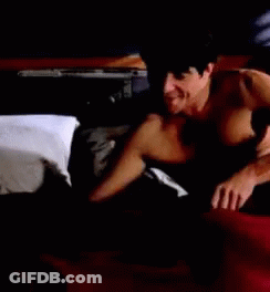 Shirtless Man Laying On Bed GIF