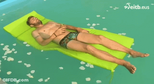 Shirtless Man Laying On Green Raft In Pool With Eitb.eus GIF