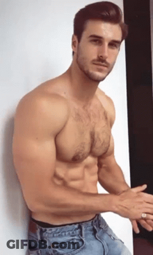 Shirtless Man Leaning Against Wall GIF