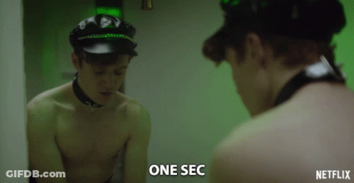 Shirtless Man Looking In Mirror With One Sec GIF