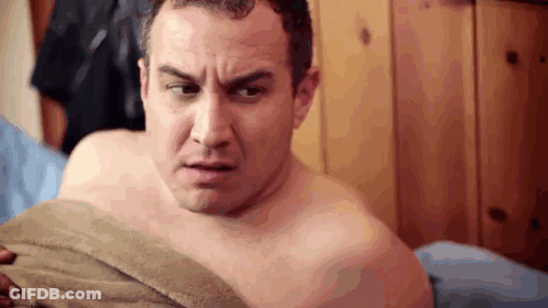 Shirtless Man Lying On Bed With Towel GIF