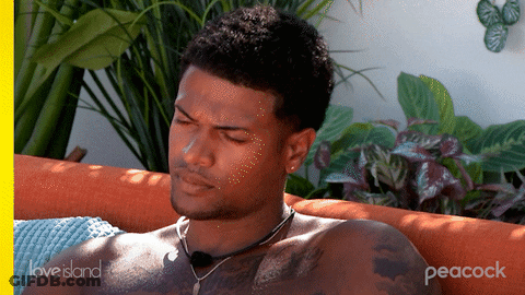 Shirtless Man Lying On Couch With Peacock GIF