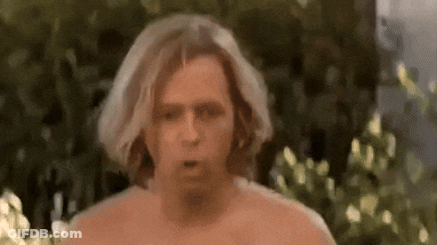 Shirtless Man Making Funny Face In Front Of Bush GIF