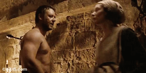 Shirtless Man Next To Woman In Dark Room GIF