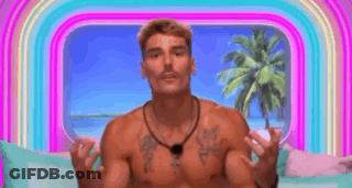 Shirtless Man On Couch With Hands Up Before Rainbow GIF