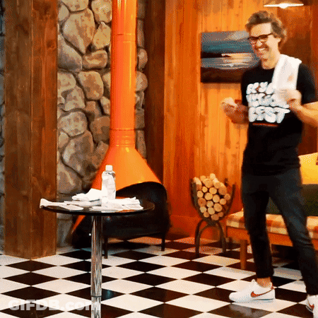Shirtless Man On Dresser In Blue Shorts GIF