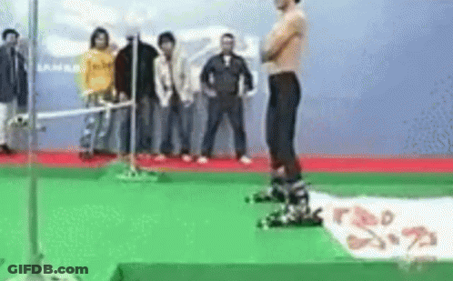 Shirtless Man On Green Carpet With Crowd GIF