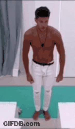 Shirtless Man On Green Mat GIF