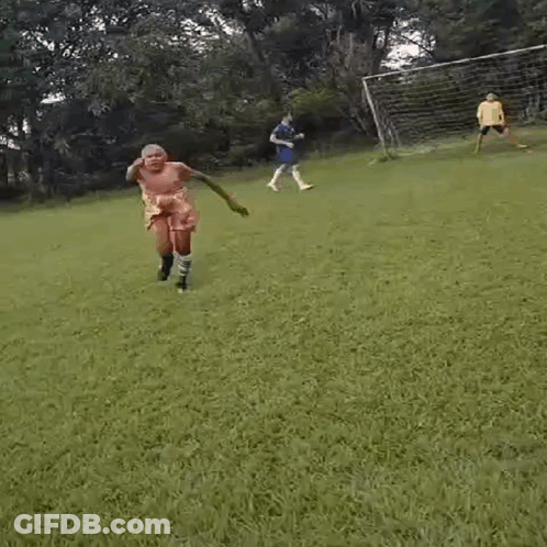 Shirtless Man On Soccer Field In Shorts And Socks GIF