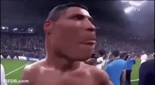 Shirtless Man On Soccer Field With Crowd GIF