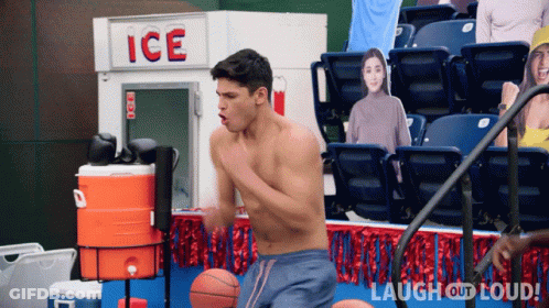 Shirtless Man Playing Basketball In Front Of Ice Sign GIF