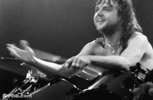 Shirtless Man Playing Drums On Stage GIF