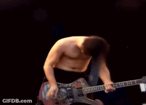 Shirtless Man Playing Guitar With Letter G GIF