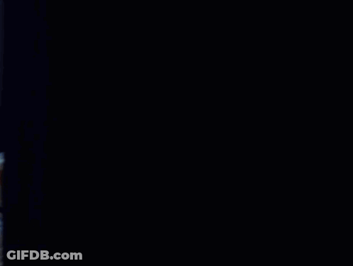 Shirtless Man Reading Newspaper On Bed GIF
