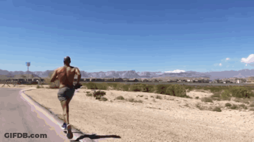 Shirtless Man Running In Desert GIF