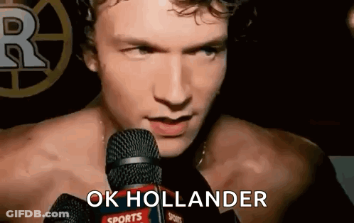 Shirtless Man Saying Ok Hollander Into Mic GIF